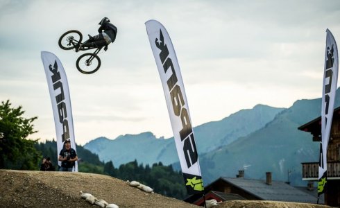 Contestant Sending large whip over the whip-off jump at Crankworx Les Gets
