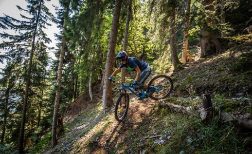 Girls riding enduro turns in Switzerland